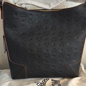 MCM Black Leather Messenger Bag with Monogram Pattern